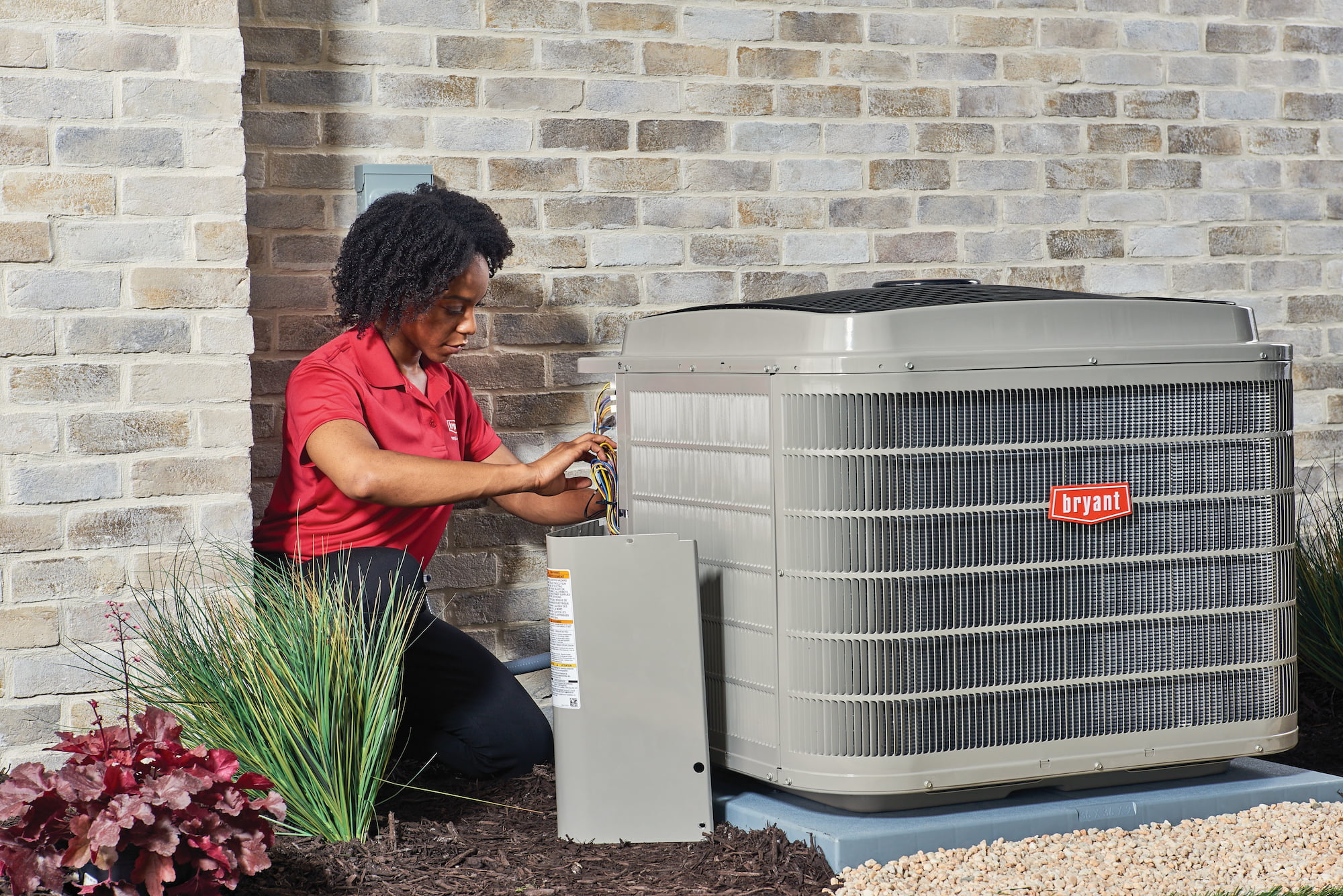 Bryant technician installing a new air conditioner