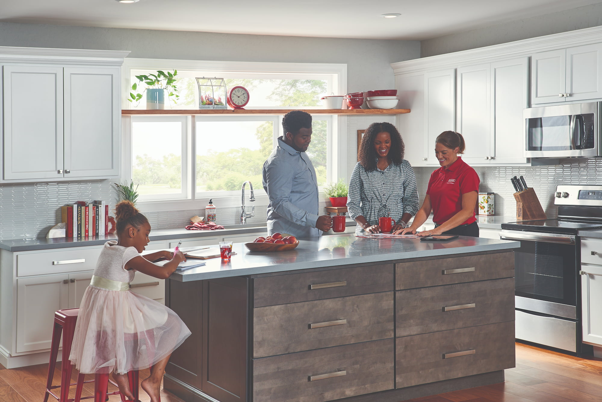 Bryant salesperson meeting with family at kitchen island