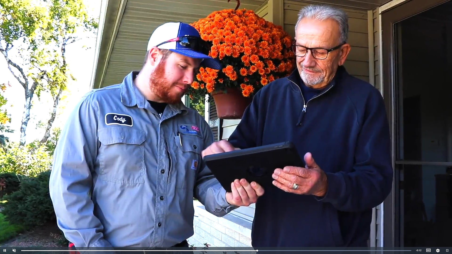 Cody with customer signing tablet